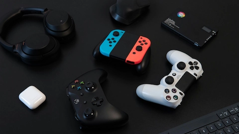 Photo of different video game controllers on a table